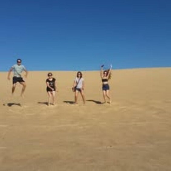 A group of people in a desert landscape. 5