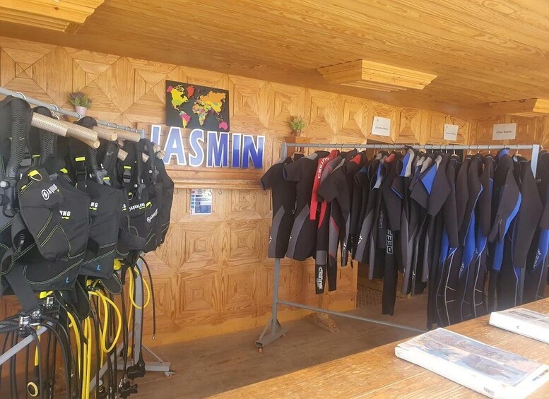 A diving shop with wetsuits and diving gear. 4