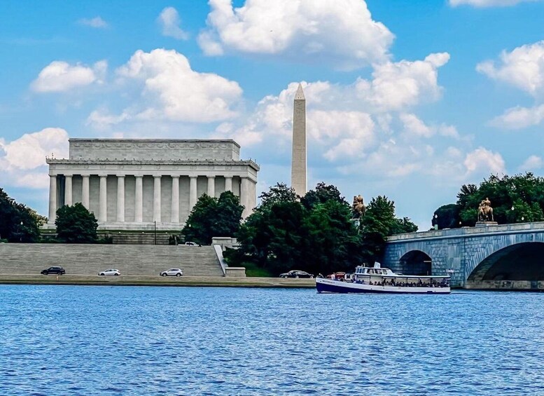 The Lincoln Memorial and Washington Monument with a river and a bridge in the foreground. 1