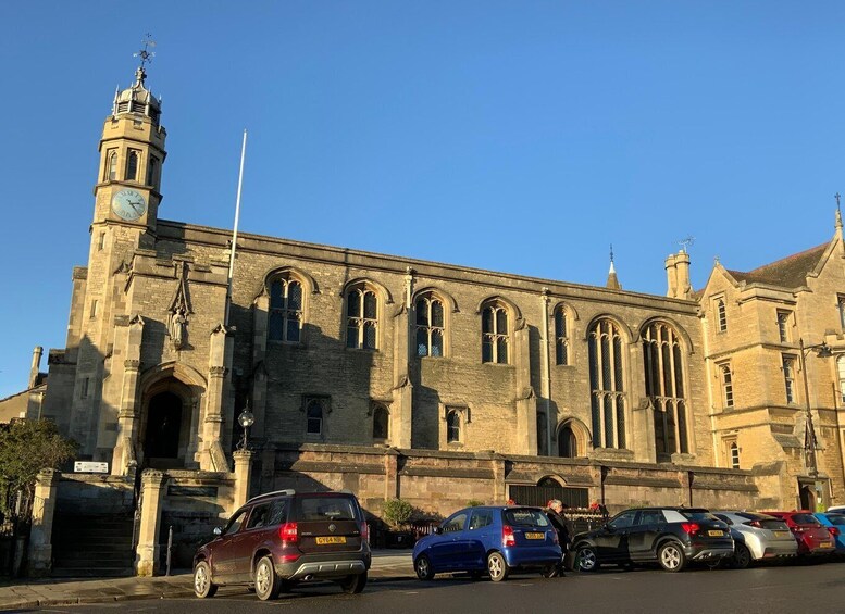 A historic building with a clock tower and arched windows. 5