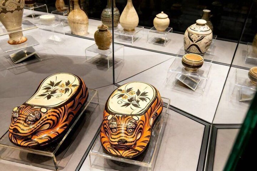 A display of traditional pottery with intricate designs. 5
