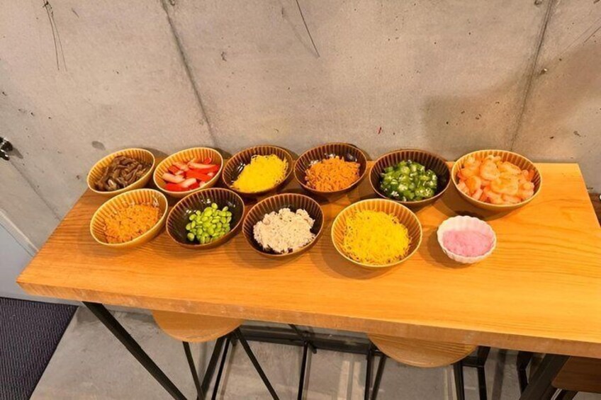 A wooden table with various bowls containing different food items. 2