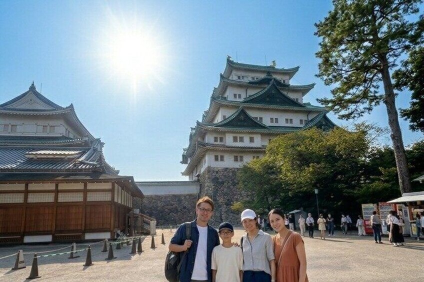 A traditional Japanese castle with multiple tiers and a clear sky. 4