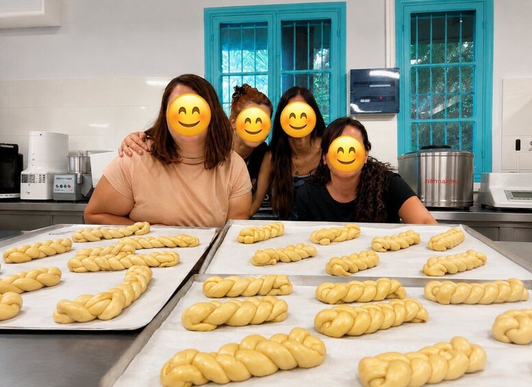 Four people in a kitchen with braided bread on baking trays. 4