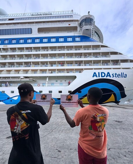 A large cruise ship with multiple decks and the name 'AIDAstella' visible on its side. 2
