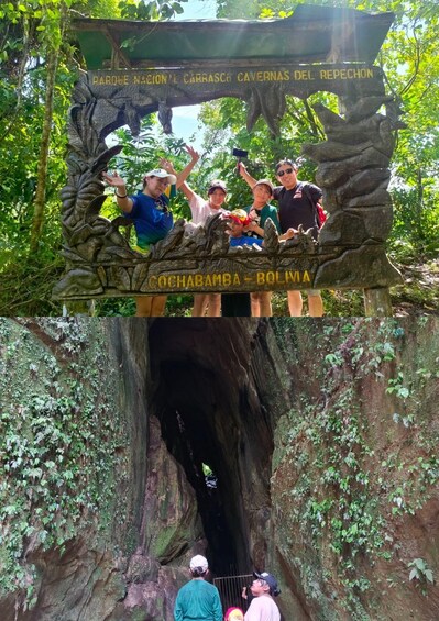 A wooden sign with carved figures and text, a large tree trunk, and a cave entrance. 2