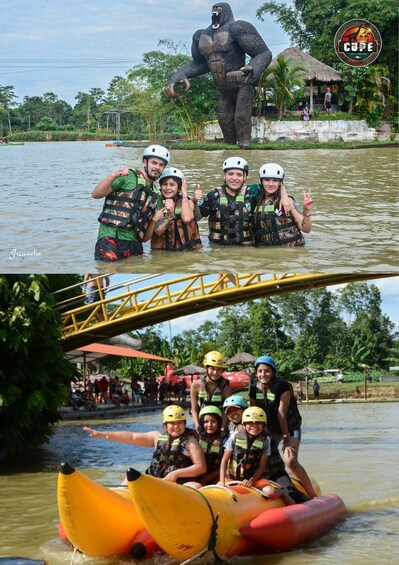 People in water with a large animal statue and a bridge. 3