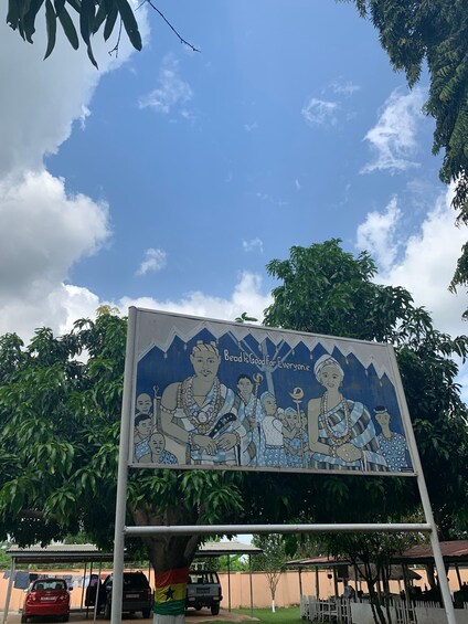 A billboard with a cultural scene and the text 'Beads is Good for Everyone.' 2