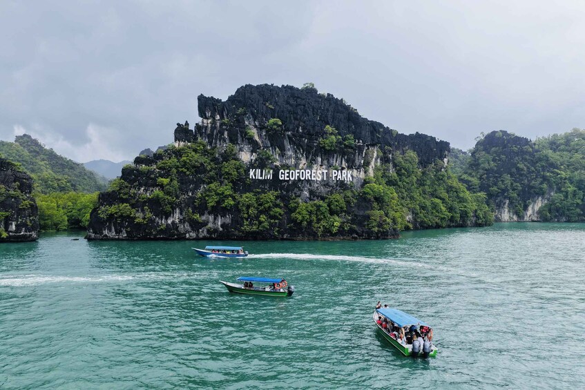 A boat trip in KILIM GEOFOREST PARK with clear water and rocky cliffs. 1