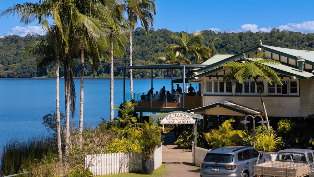 A lakeside view with a building labeled 'The Teahouse at Lake Barrine.' 4
