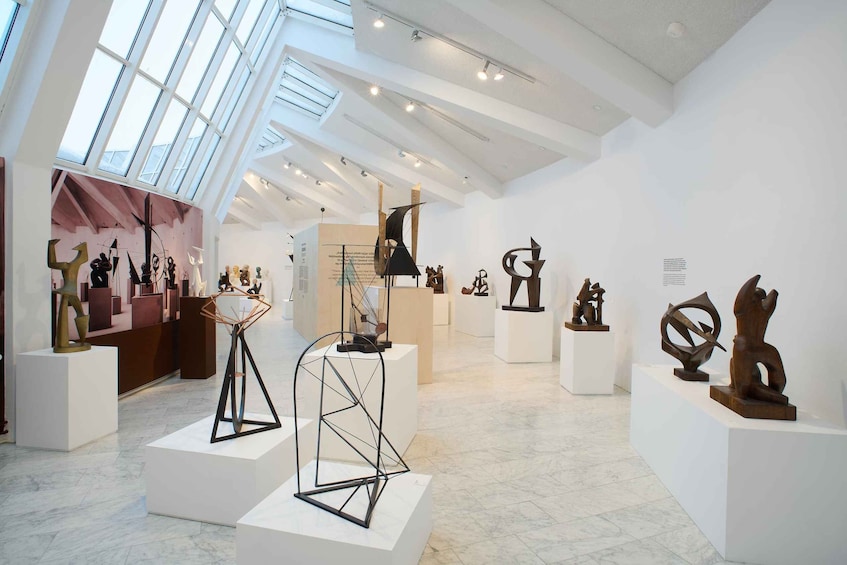 An art gallery with modern sculptures on display. 5