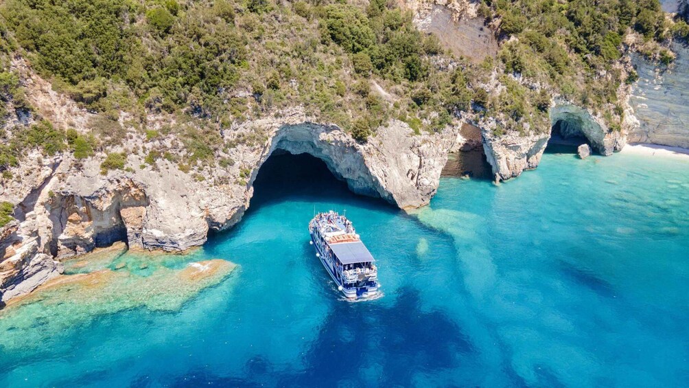 A boat navigating through a narrow waterway between rocky cliffs. 4