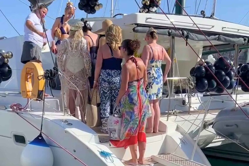 A group of people on a boat with a clear sky. 2