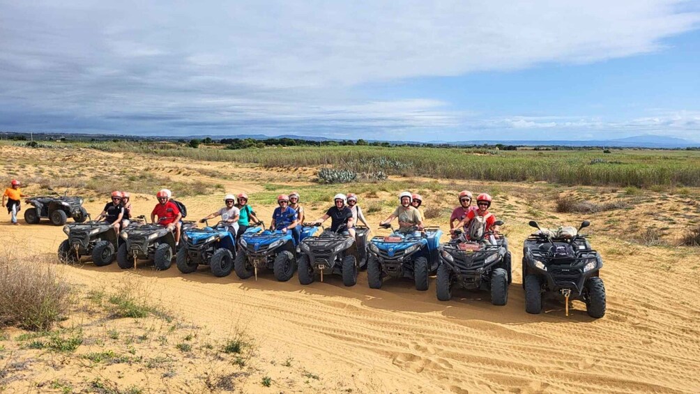 A group of people on ATVs in a desert landscape. 3