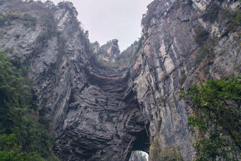 A canyon with steep rock walls and a narrow passage. 2
