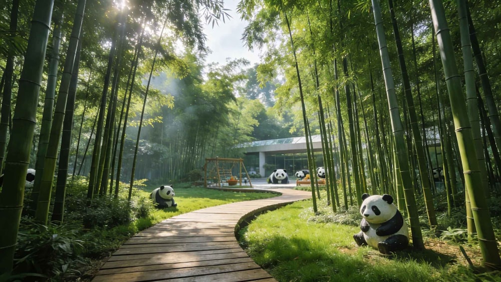 A bamboo forest with a wooden pathway, large panda sculptures, and a modern building in the background. 2