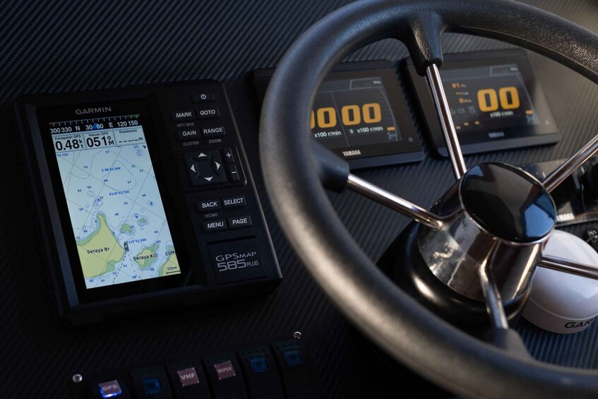 A Garmin GPS device with a map display, a speedometer, and a tachometer. 5