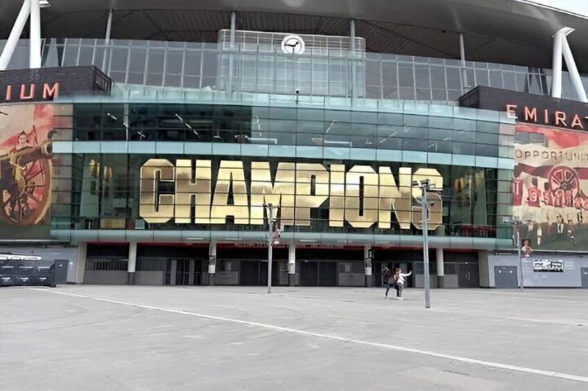 A stadium with a large 'CHAMPIONS' sign. 3
