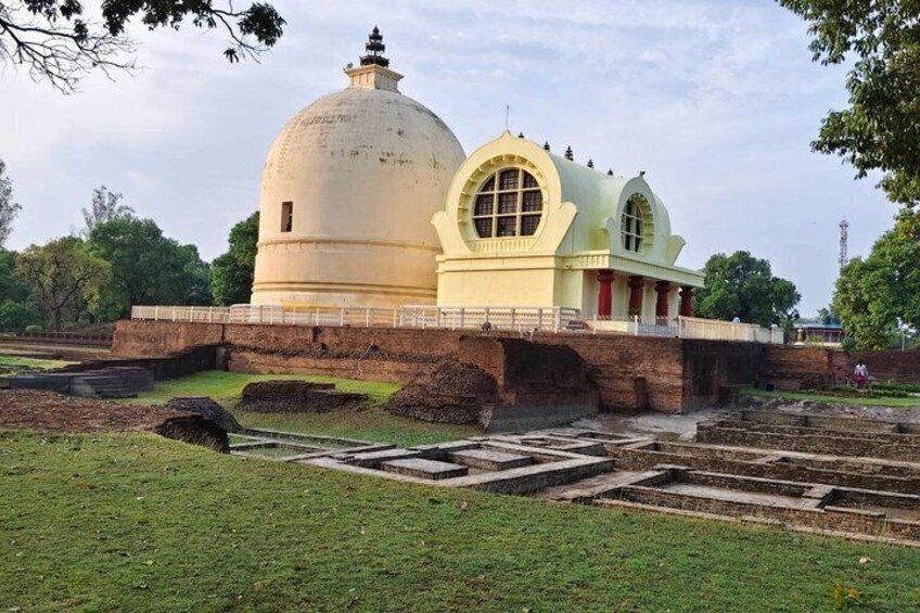An ancient structure with a large dome and a smaller building with arched windows. 2