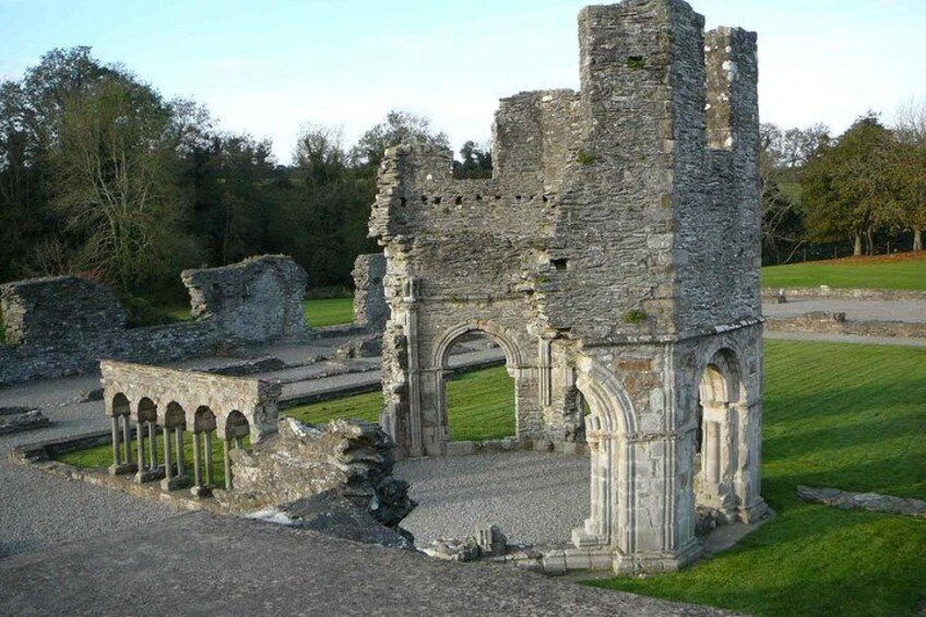 A historical stone structure with arches and ruins. 2