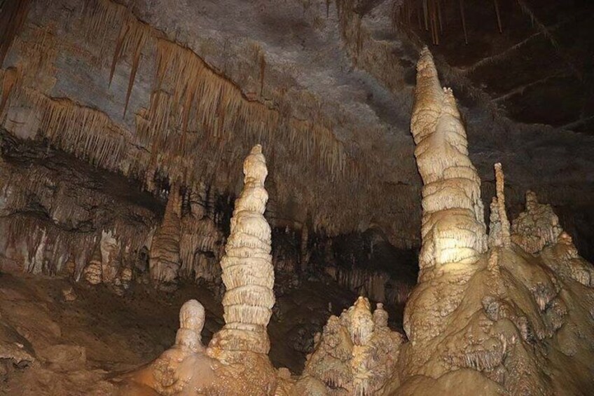 A cave with stalactites and stalagmites. 5