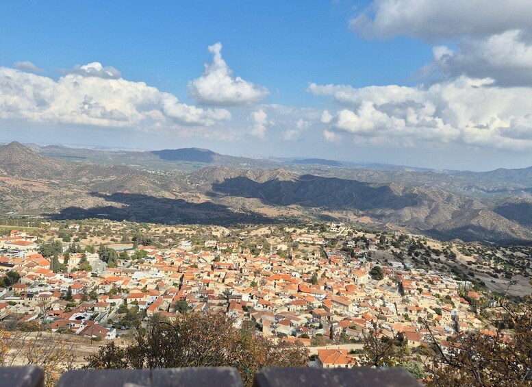 A town nestled in a valley with mountains in the background. 3