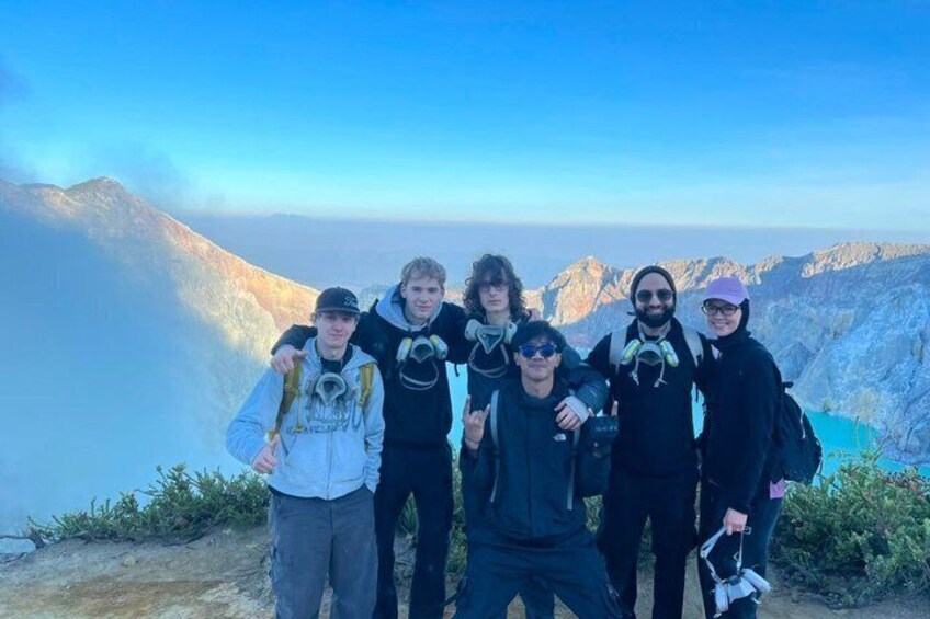 A group of people with backpacks on a mountain trail. 4