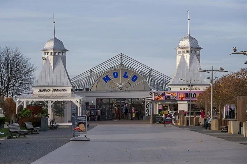 A building with a large sign reading 'MOLLO' and two towers. 4