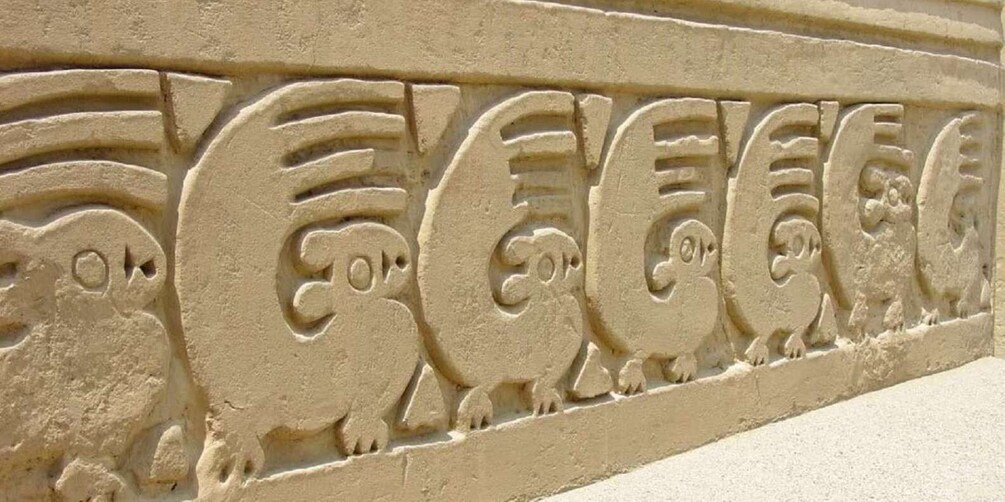 A relief sculpture of stylized animal figures. 2