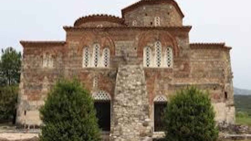 A historical building with arched windows and a dome. 2