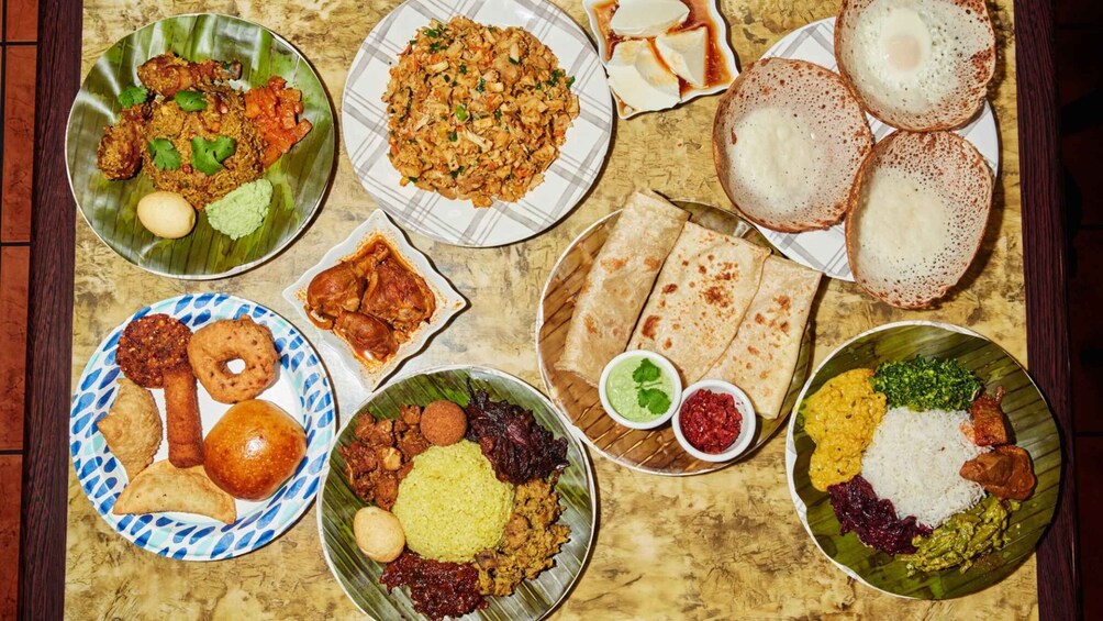 A variety of Indian dishes including curries, flatbreads, and rice. 5