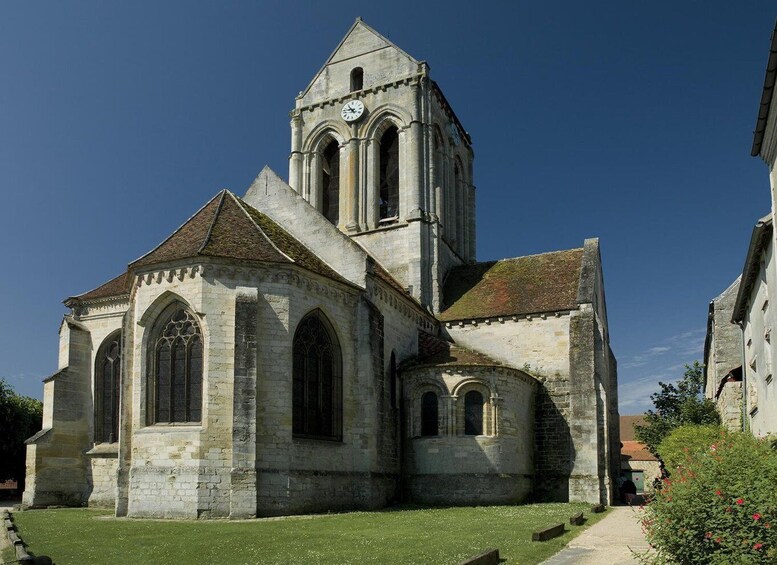 A historic church with a prominent bell tower and arched windows. 4
