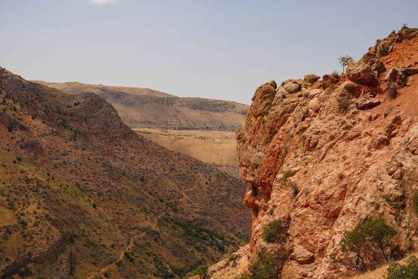 A rugged mountainous landscape with a clear sky. 3