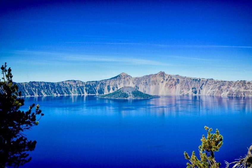A calm lake with mountains in the background. 2