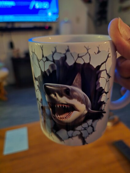 A mug with a shark design. 5