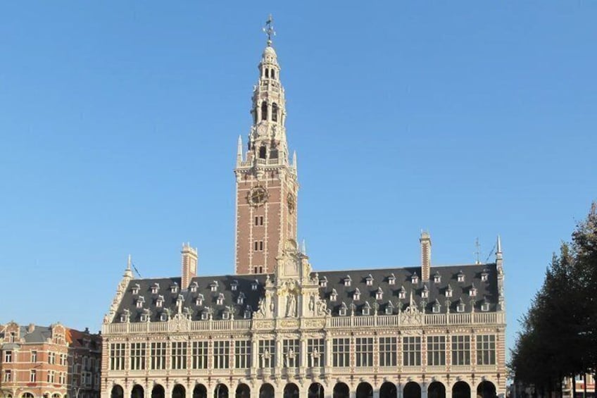 A historic building with a prominent clock tower and ornate architecture. 2