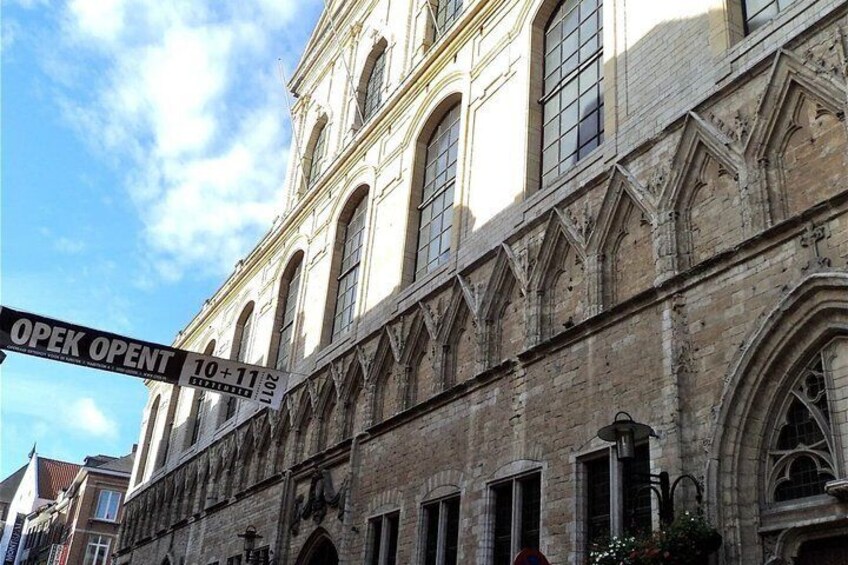 A historic building with arched windows and intricate stonework. 4