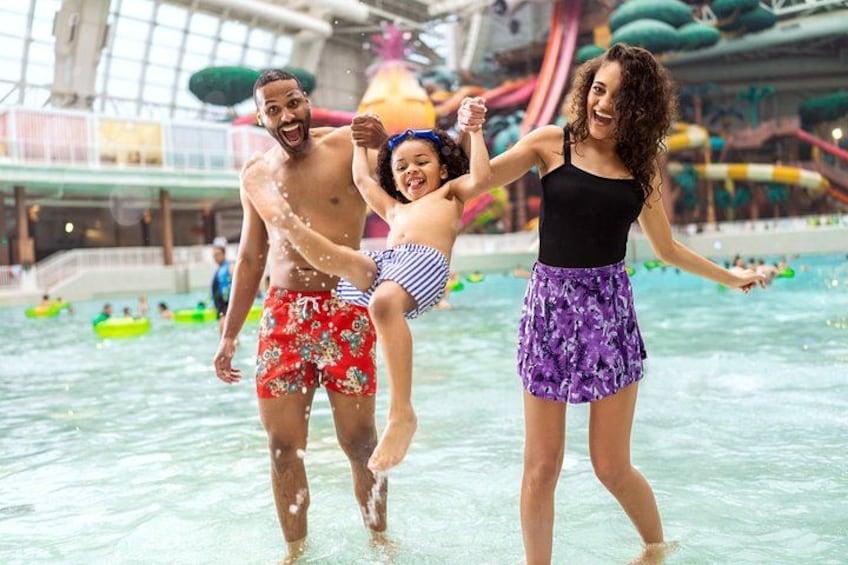 An indoor water park with slides and rafts. 1