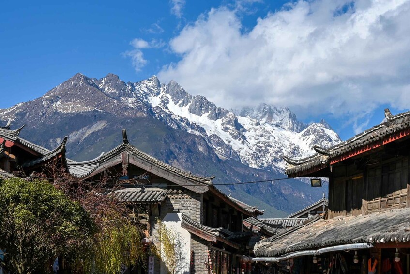 Traditional architecture with a mountainous backdrop. 2