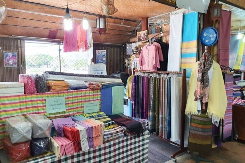 A fabric store with various textiles on display. 5