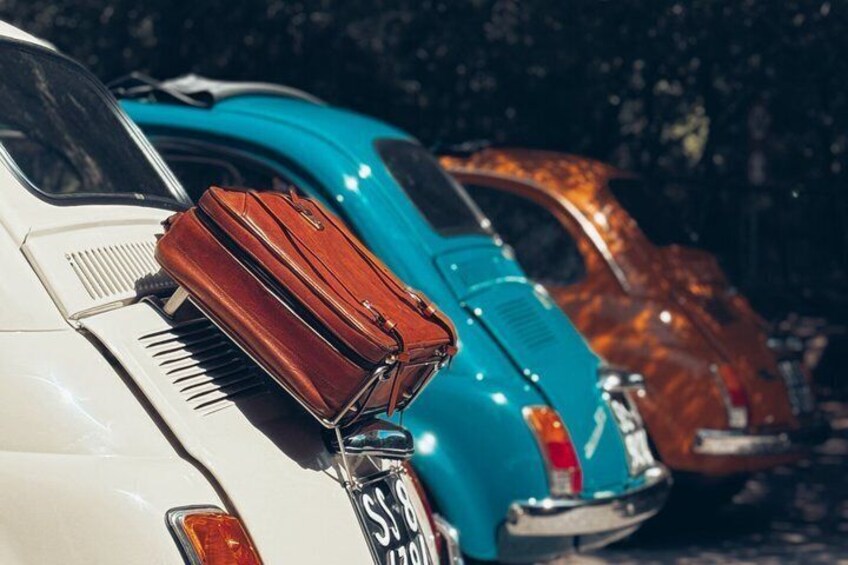 Vintage cars parked closely together. 5
