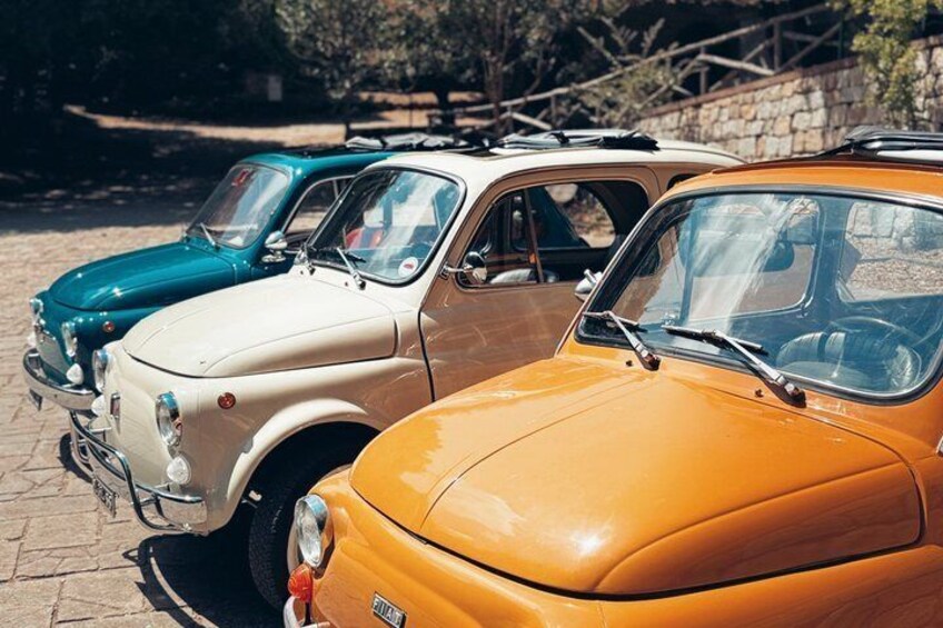 Vintage cars parked in a row. 4