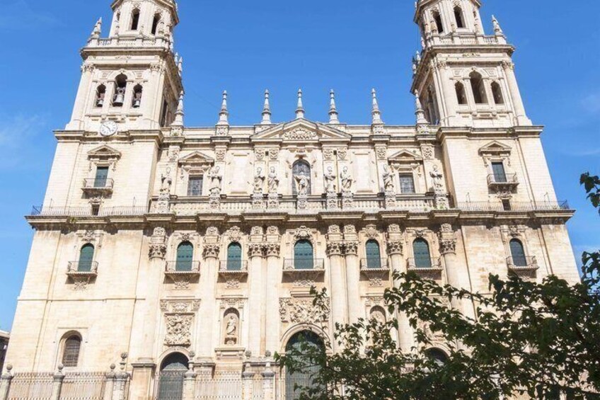 A large, ornate cathedral with two bell towers and intricate architectural details. 4