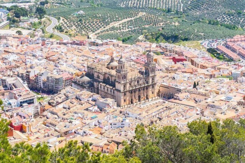 A cityscape with a prominent historical building surrounded by modern architecture. 1