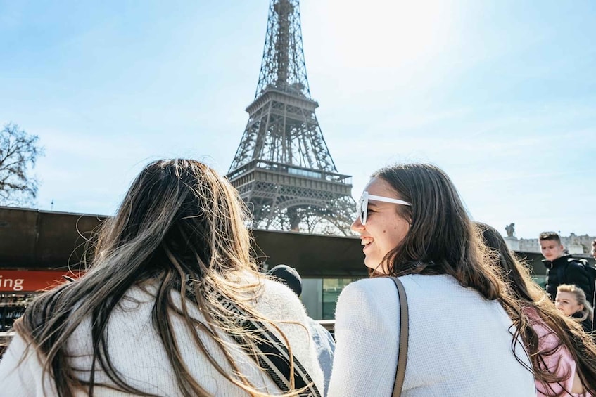 Two people with the Eiffel Tower in the background. 3
