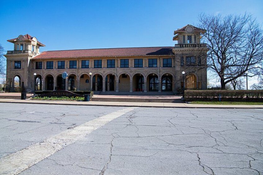 A historic building with arched windows and a clock tower. 5