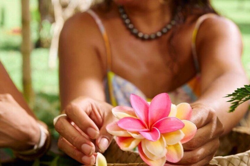 A person holding a flower. 2