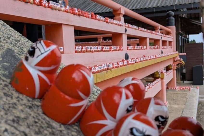 A red and white patterned structure with multiple levels, possibly a decorative or functional building. 4