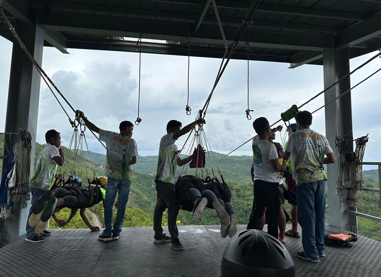 A group of people preparing for a zipline adventure. 2