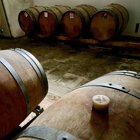 Wooden barrels in a storage area. 5